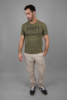 Man wearing green tee with black JESUS & JIU-JITSU logo