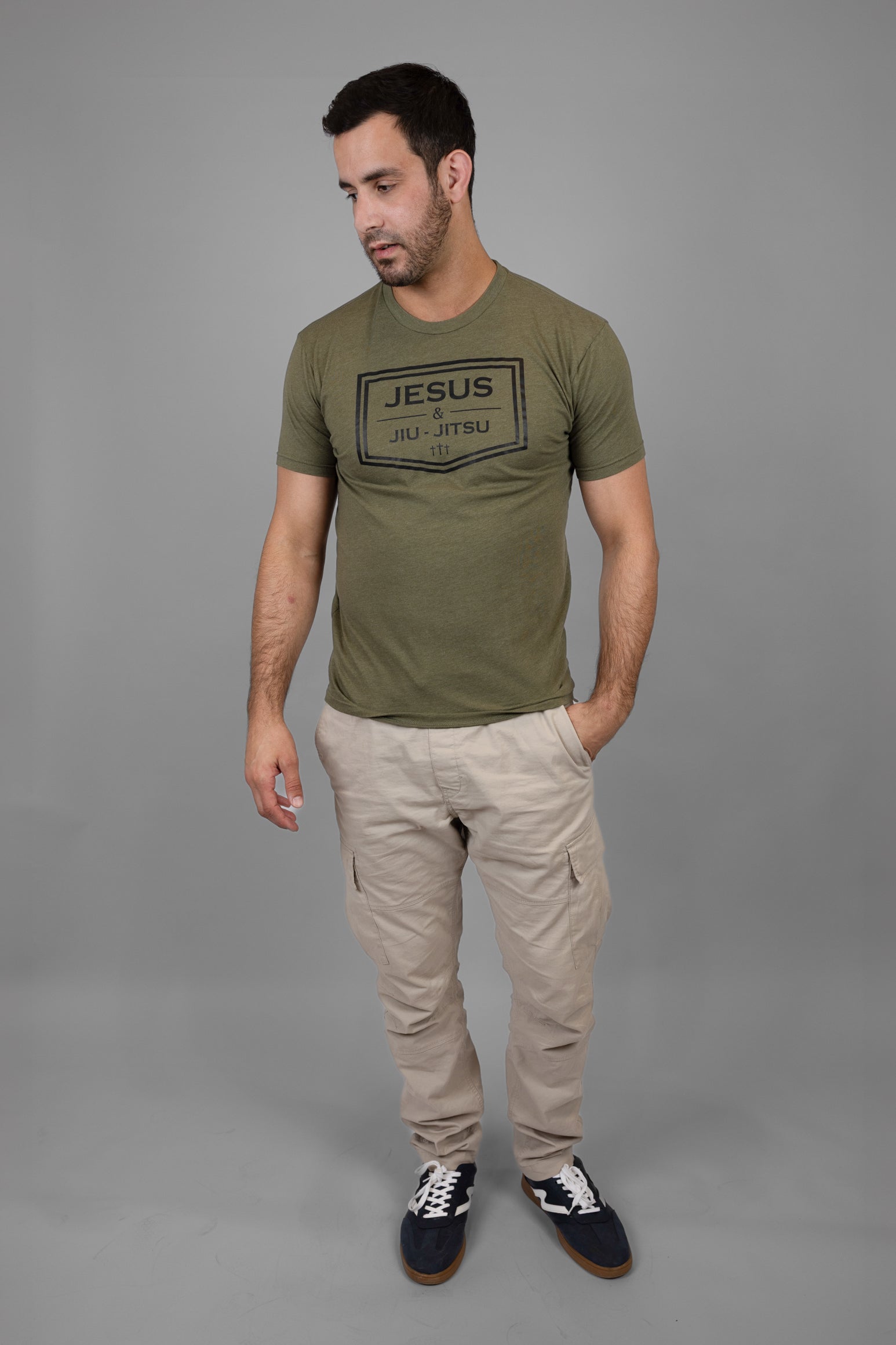 Man wearing green tee with black JESUS & JIU-JITSU logo