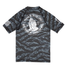 Youth Rashguard with a graphic design on the back featuring praying hands and text, on a white background.