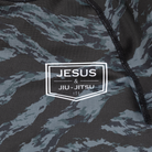 closeup of JJJ logo on youth camo rashguard