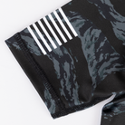 Flag graphic on sleeve of youth camo rashguard
