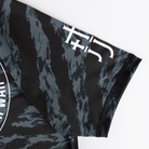 closeup of JJJ logo on sleeve of ladies camo rashguard