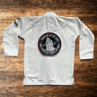 10in Patch with praying hands design and "PRAISE BE TO THE LORD WHO TRAINS MY HANDS FOR WAR" text on a white gi