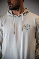 Man in smoke hoodie with JJJ logo on left chest